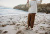 US stockist of Grown Clothing's gender neutral cotton Rib Flare Pants in Moss.