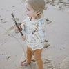 US stockist of Grown Clothing's gender neutral, organic cotton, ribbed essential leggings in Buttermilk.