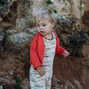 US stockist of Grown Clothing's gender neutral, merino wool cardigan in Tangerine.