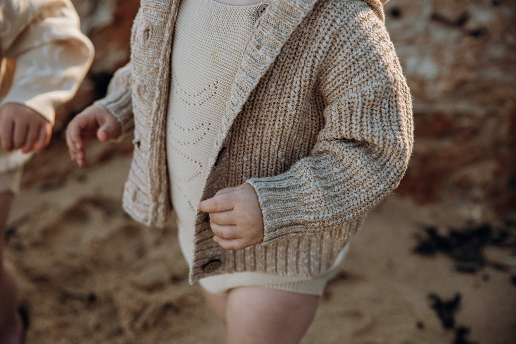 US stockist of Grown Clothing's gender neutral, chunky knit rib hoodie cardigan in Ecru.