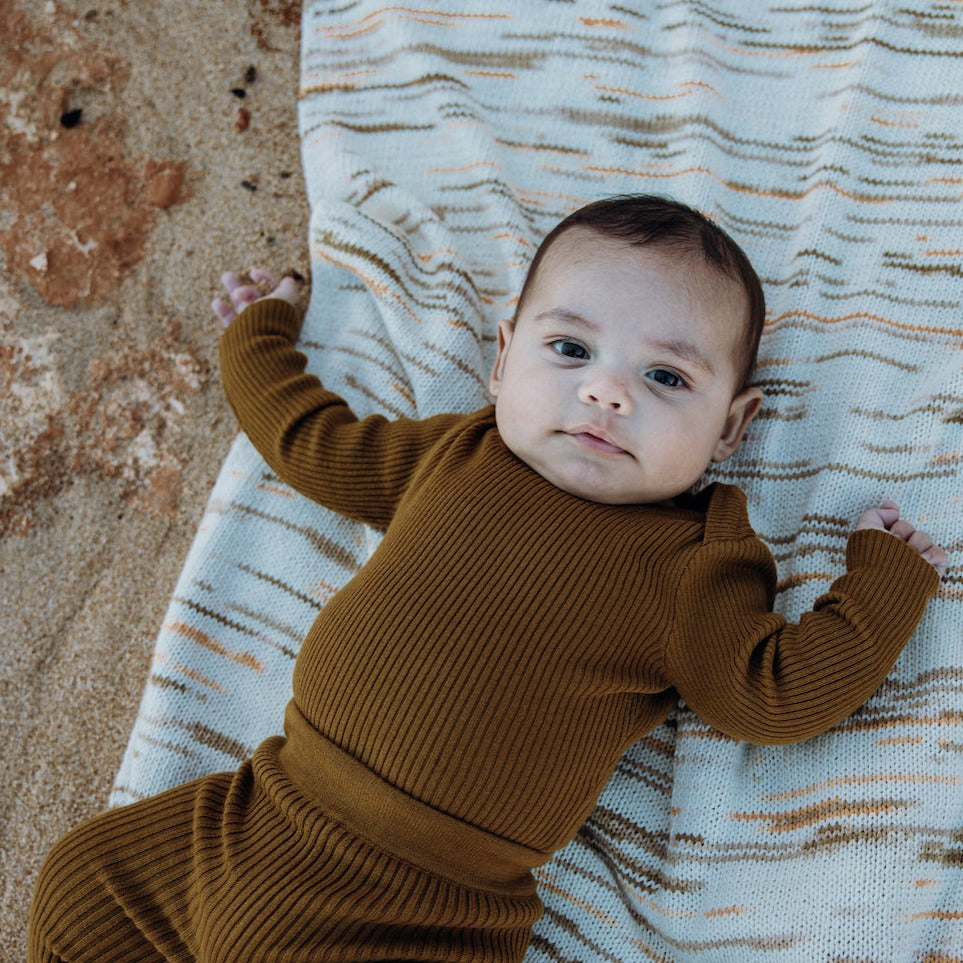 US stockist of Grown Clothing's gender neutral, organic cotton ribbed essential bodysuit in Moss.