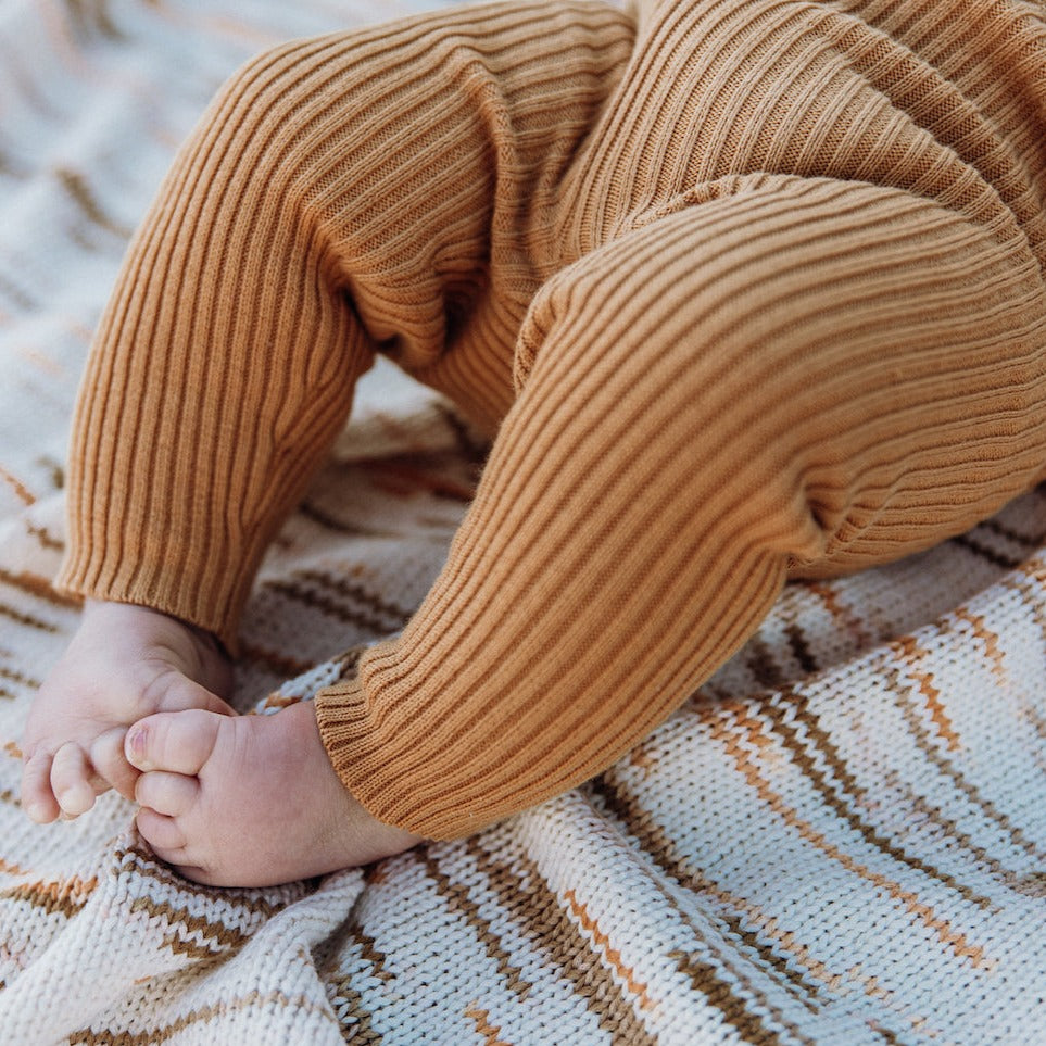 US stockist of Grown Clothing's gender neutral, organic cotton, ribbed essential leggings in Buttermilk.