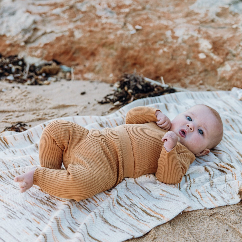 US stockist of Grown Clothing's gender neutral, organic cotton, ribbed essential leggings in Buttermilk.
