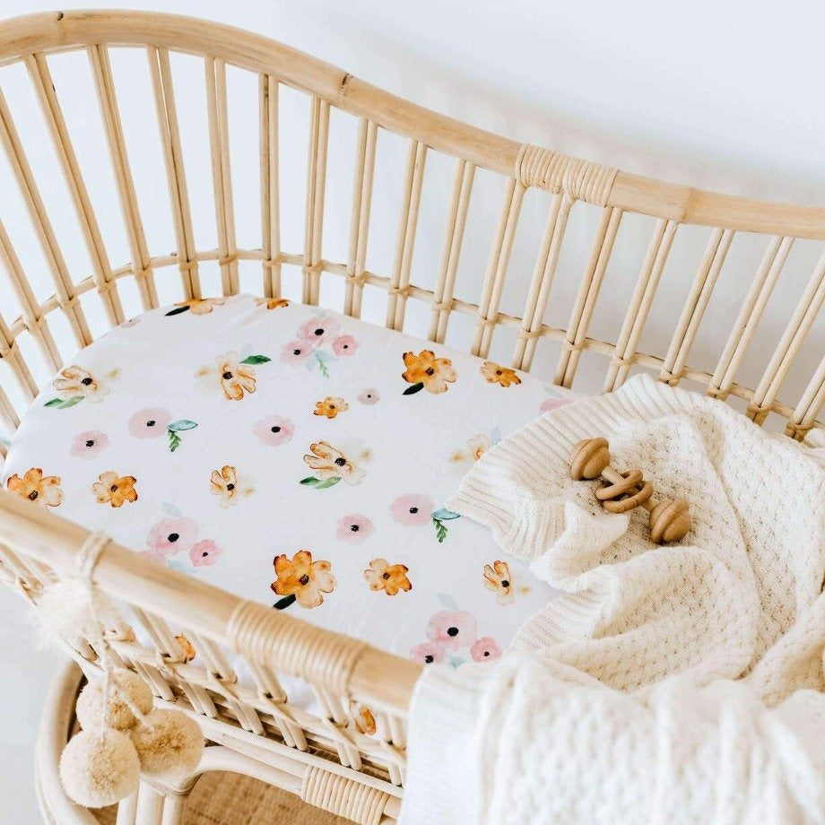US stockist of Snuggle Hunny Kid's Poppy stretch cotton jersey bassinet sheet. White color with pink and yellow poppy print.
