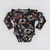 US stockist of Snuggle Hunny Kid's organic long sleeve ruffle bodysuit in Belle.