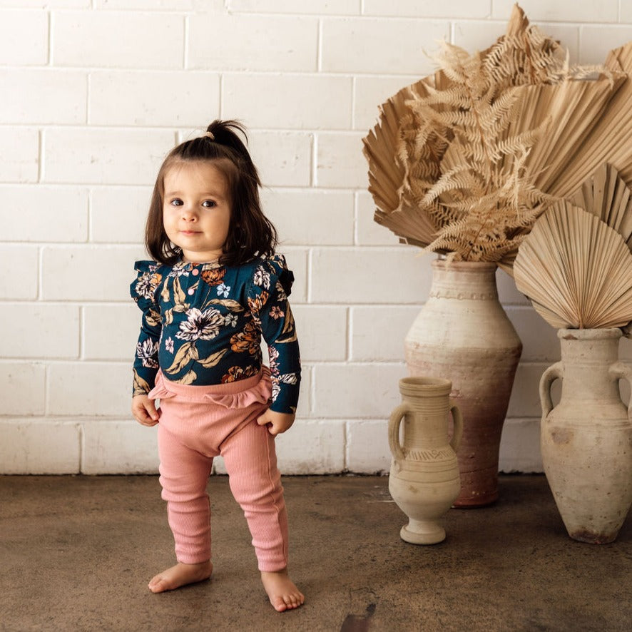 US stockist of Snuggle Hunny Kid's organic long sleeve ruffle bodysuit in Belle.