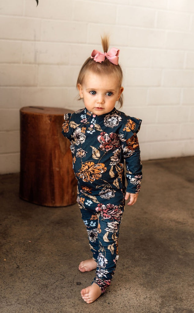 US stockist of Snuggle Hunny Kid's organic jersey Belle ruffle zip growsuit.
