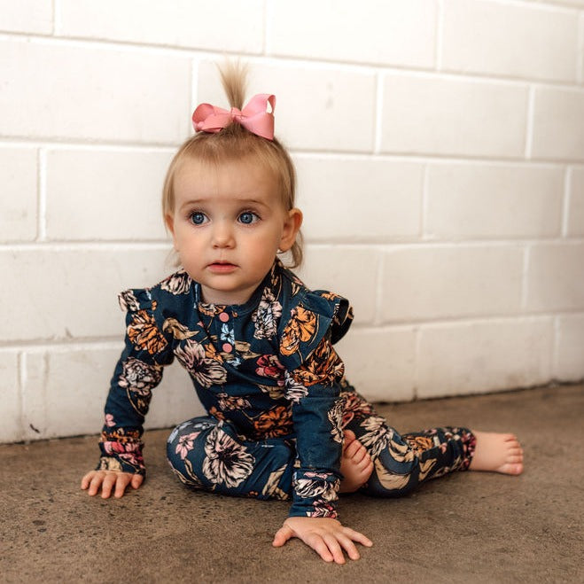 US stockist of Snuggle Hunny Kid's organic jersey Belle ruffle zip growsuit.