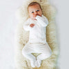 Stockist of Bonsie's rayon blend milk footie.  Top section has velcro wrap body which can be undone for skin to skin contact.  Elastic waist that can be pulled down for easy diaper changes. 