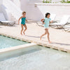 US stockist of Canopea's Bari Green halterneck swimsuit with ruffle at neck and back.  Made from recycled UPF 50 fabric.