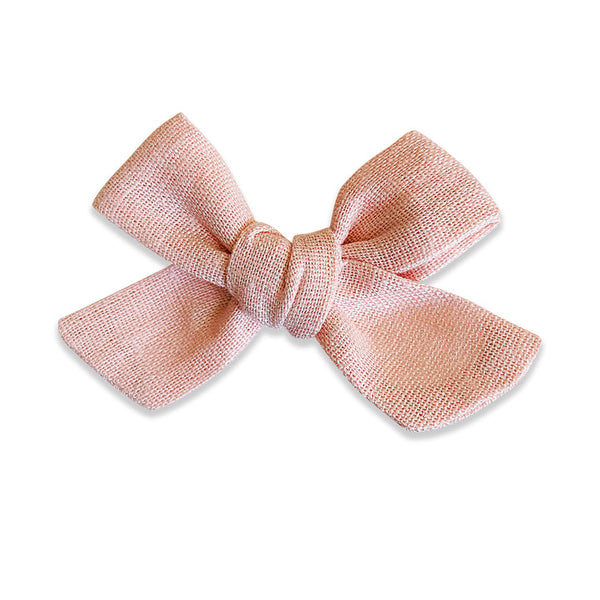 US stockist of Josie Joan's Charlie classic bow clip.  Made from cotton/linen in a shade of soft pink.