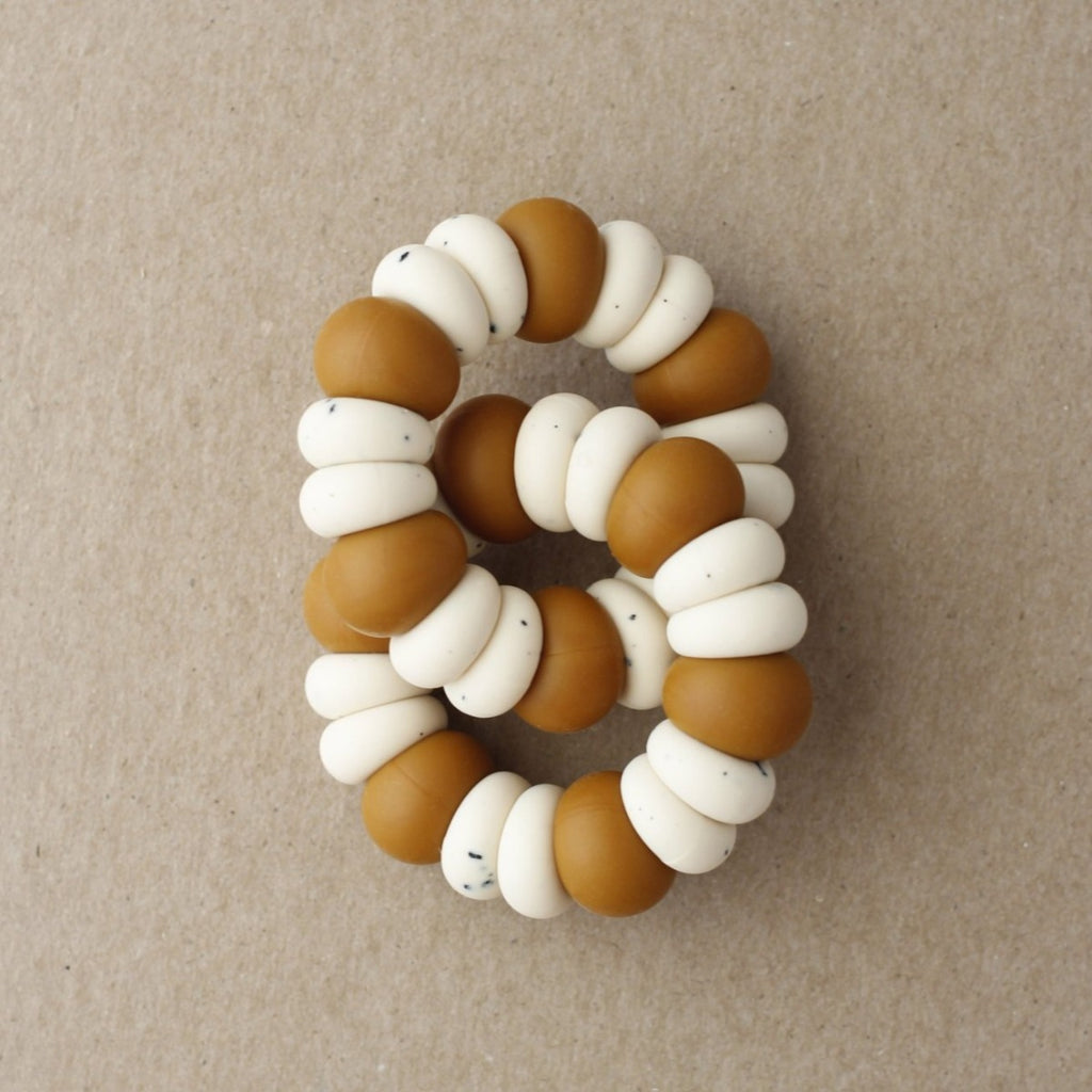 US stockist of Little Chew's gender neutral Polka Dot silicone double freezer teether in Clay