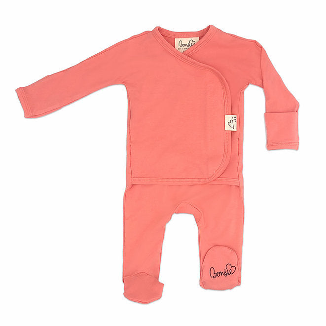Stockist of Bonsie's rayon blend Burnt Coral footie.  Top section has velcro wrap body which can be undone for skin to skin contact.  Elastic waist that can be pulled down for easy diaper changes. 