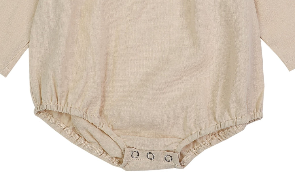 US stockist of Donsje's long sleeve chloe bodysuit in Buttercream.  Made from cotton with a ruffle neck.