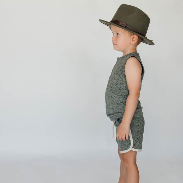US stockist of Buck & Baa's organic dappled henley tank top.  Made from organic cotton and elastane in a blue/green color with all over spotted print. Coconut buttons on front placket.