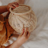 US stockist of Olli Ella's handmade rattan egg basket.  Opens at top and features a handle on top.