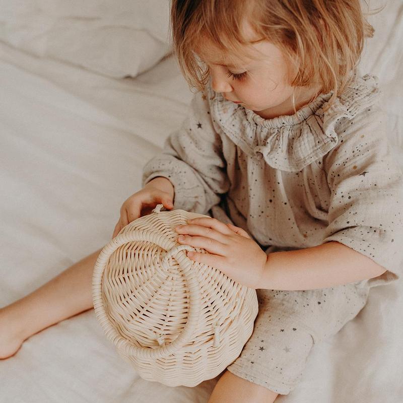 US stockist of Olli Ella's handmade rattan egg basket.  Opens at top and features a handle on top.