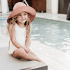 US stockist of Fini the Label's gender neutral, floppy swim hat in cocoa. Features elongated back for added sun protection, chin strap and adjustable bow around crown for better fit. Brim is medium stiffness and can be flipped up at front.  Made from nylon/spandex and is quick drying.