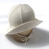US stockist of Fini the Label's gender neutral, floppy swim hat in cream. Features elongated back for added sun protection, chin strap and adjustable bow around crown for better fit. Brim is medium stiffness and can be flipped up at front.  Made from nylon/spandex and is quick drying.