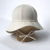 US stockist of Fini the Label's gender neutral, floppy swim hat in cream. Features elongated back for added sun protection, chin strap and adjustable bow around crown for better fit. Brim is medium stiffness and can be flipped up at front.  Made from nylon/spandex and is quick drying.