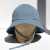 US stockist of Fini the Label's gender neutral, floppy swim hat in heaven. Features elongated back for added sun protection, chin strap and adjustable bow around crown for better fit. Brim is medium stiffness and can be flipped up at front.  Made from nylon/spandex and is quick drying.