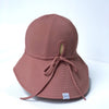 US stockist of Fini the Label's gender neutral, floppy swim hat in marsala. Features elongated back for added sun protection, chin strap and adjustable bow around crown for better fit. Brim is medium stiffness and can be flipped up at front.  Made from nylon/spandex and is quick drying.