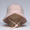 US stockist of Fini the Label's floppy swim hat in pale pink. Features elongated back for added sun protection, chin strap and adjustable bow around crown for better fit. Brim is medium stiffness and can be flipped up at front.  Made from nylon/spandex and is quick drying.