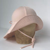 US stockist of Fini the Label's floppy swim hat in pale pink. Features elongated back for added sun protection, chin strap and adjustable bow around crown for better fit. Brim is medium stiffness and can be flipped up at front.  Made from nylon/spandex and is quick drying.