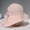 US stockist of Fini the Label's floppy swim hat in pale pink. Features elongated back for added sun protection, chin strap and adjustable bow around crown for better fit. Brim is medium stiffness and can be flipped up at front.  Made from nylon/spandex and is quick drying.