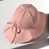 US stockist of Fini the Label's floppy swim hat in pink. Features elongated back for added sun protection, chin strap and adjustable bow around crown for better fit. Brim is medium stiffness and can be flipped up at front.  Made from nylon/spandex and is quick drying.
