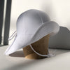 US stockist of Fini the Label's gender neutral floppy swim hat in white. Features elongated back for added sun protection, chin strap and adjustable bow around crown for better fit. Brim is medium stiffness and can be flipped up at front.  Made from nylon/spandex and is quick drying.