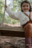 US stockist of Silly Silas gender neutral retro ribbed footed tights in cinnamon.  Made from 100% cotton and featuring braces.