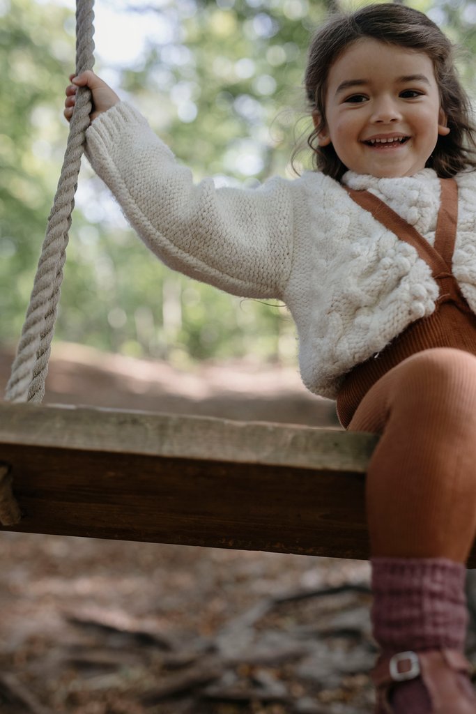 US stockist of Silly Silas gender neutral retro ribbed footed tights in cinnamon.  Made from 100% cotton and featuring braces.