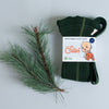 US stockist of Silly Silas' gender neutral, organic cotton footed tights in Dark Forest Green.