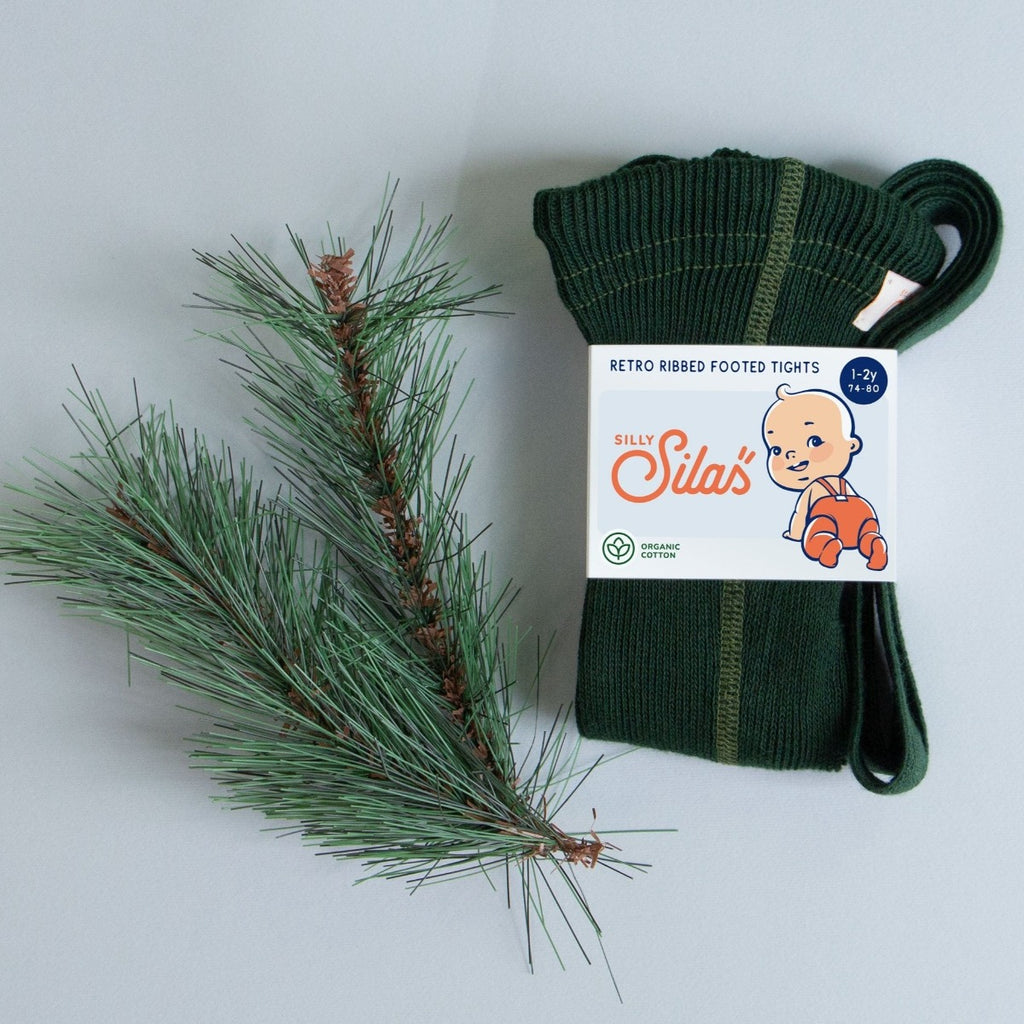 US stockist of Silly Silas' gender neutral, organic cotton footed tights in Dark Forest Green.