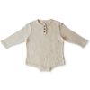 US stockist of Grown Clothing's gender neutral, organic cotton ribbed button bodysuit in Milk.