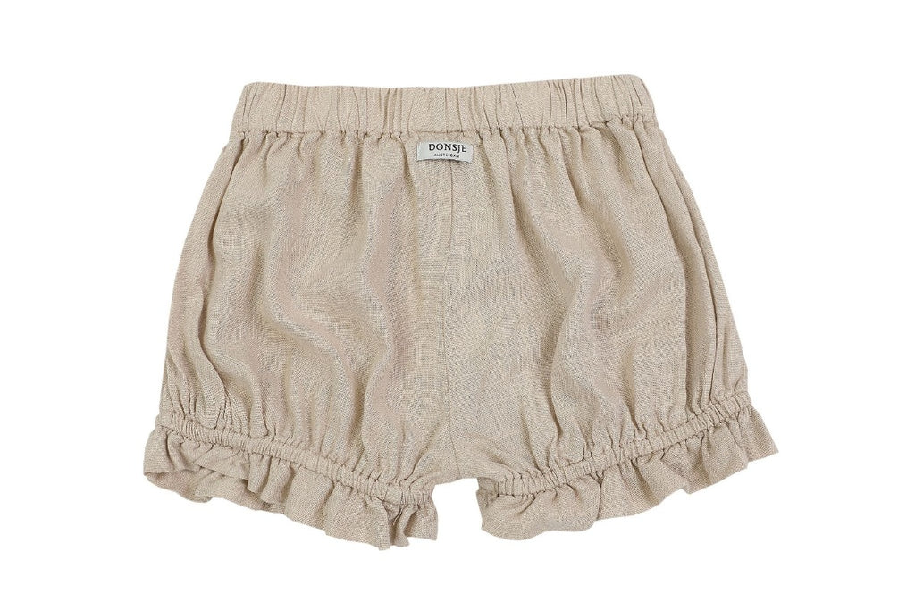 US stockist of Donsje's linen blend, Gwenda Bloomers in Beige.  Features a ruffle hem.