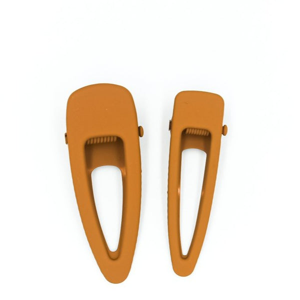 US stockist of Grech & Co's 2 piece grip hair clips.  In a matte spice color - one mini + one regular size.