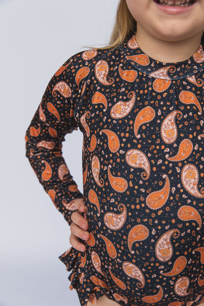 US stockist of Salty Swimwear's long sleeve rashsuit in Midnight Pretty Paisley.  Made from UPF 50+ Repreve fabric.