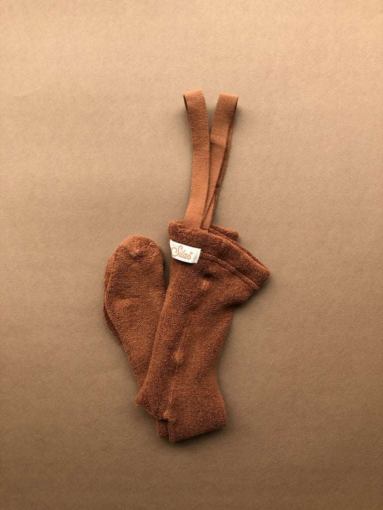 US stockist of Silly Silas' gender neutral, footed Teddy tights in Cinnamon.  Made from 100% okeo tex cotton with retro braces.