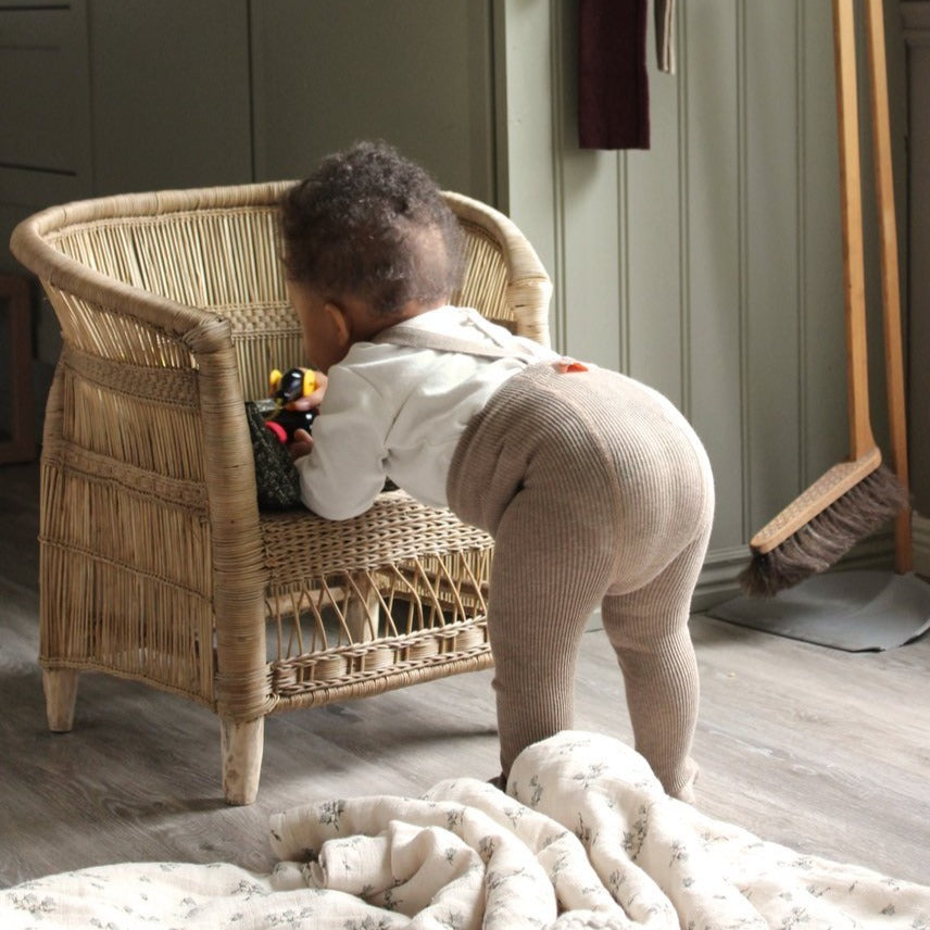 US stockist of Silly Silas gender neutral retro ribbed footed tights in Peanut blend.  Made from 100% cotton and features braces.