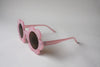 US stockist of Elle Porte's Daisy sunglasses in Fairy Floss Pink with dark lenses.
