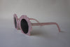 US stockist of Elle Porte's Shelly sunglasses in pink.  Shell shaped frames with dark UV 400 lenses.