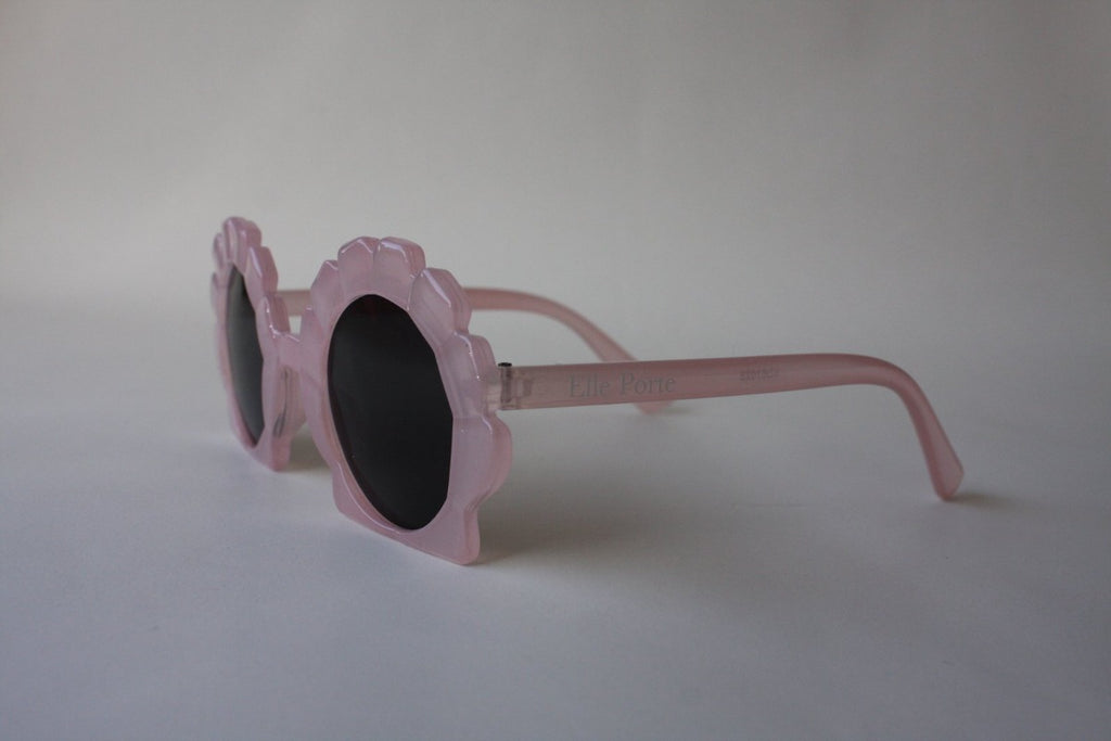US stockist of Elle Porte's Shelly sunglasses in pink.  Shell shaped frames with dark UV 400 lenses.