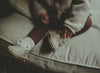 US stockist of Donsje's light grey, leather ram baby shoes with Kapi exclusive faux fur lining.  Velcro fastening - soft sole under 12mths.