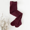 US stockist of Karibou Kids' Rosie Cozy Cable Knit Tights in Plum.  Made from a stretch cotton blend.
