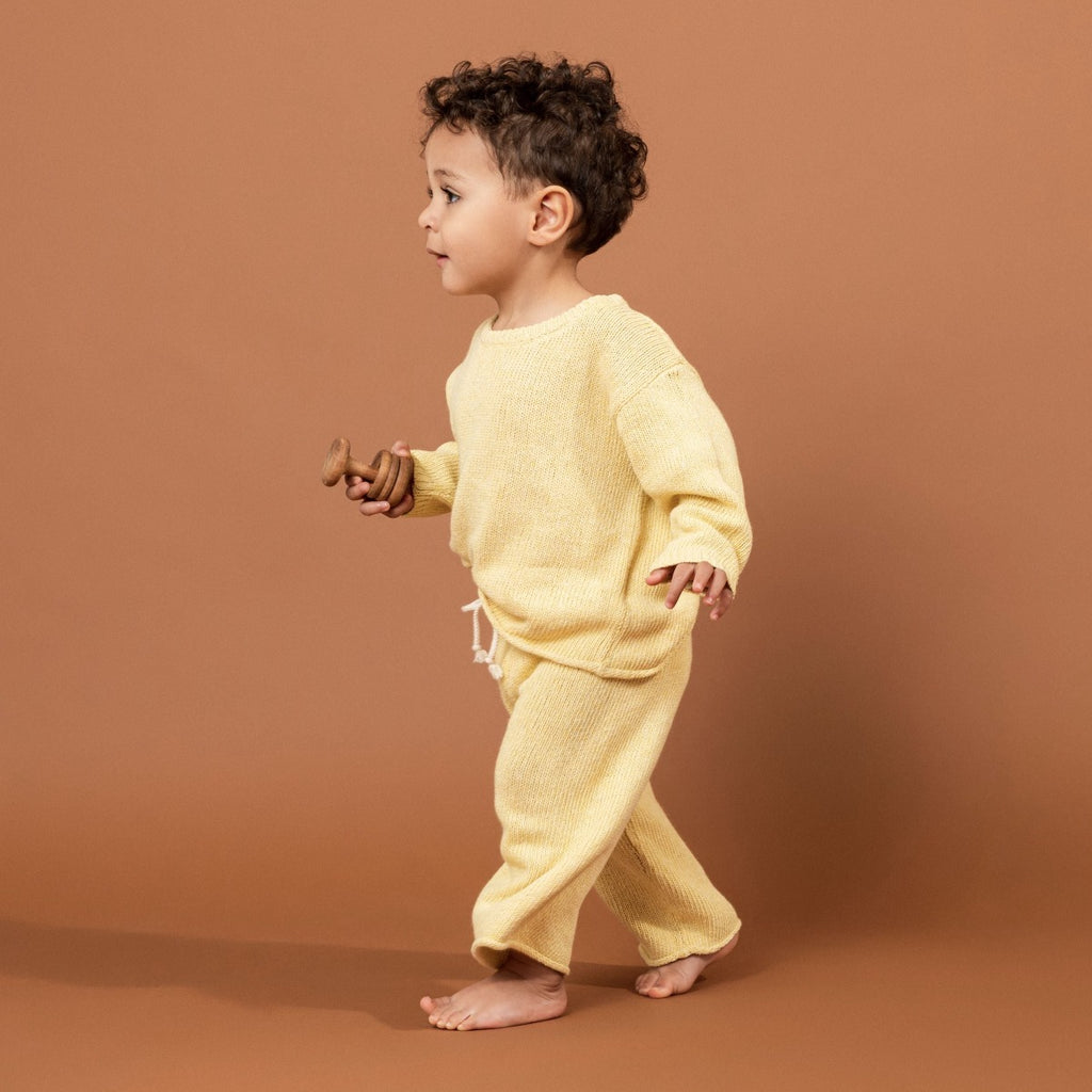US stockist of Grown Clothing's gender neutral, linen blend beach sweater in Lemon.