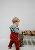 US stockist of Miann & Co's gender neutral slate baby waffle hooded sweatshirt.  Made from 100% waffle cotton.