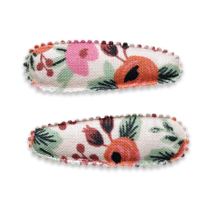 US stockist of Josie Joan's Little Marni set of two fabric baby hair clips.  Cream colored fabric with pink and orange flowers and green foilage.  Features scalloped edging.