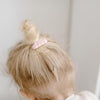 US stockist of Josie Joan's Little Mazi set of two fabric covered baby hair clips.  Gorgeous pink fabric with contrasting pale flowers and leaves.  Scalloped edging.